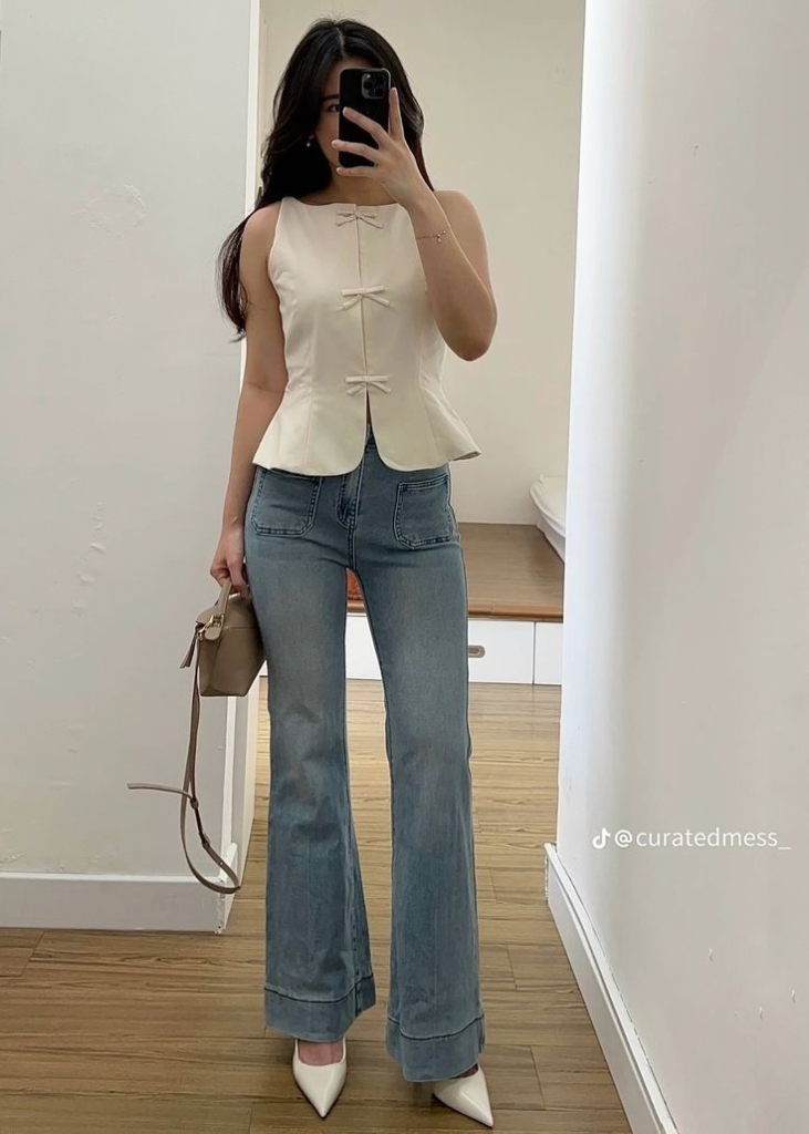 Effortless Elegance in a Cream Bow-Accent Top and Flared Denim