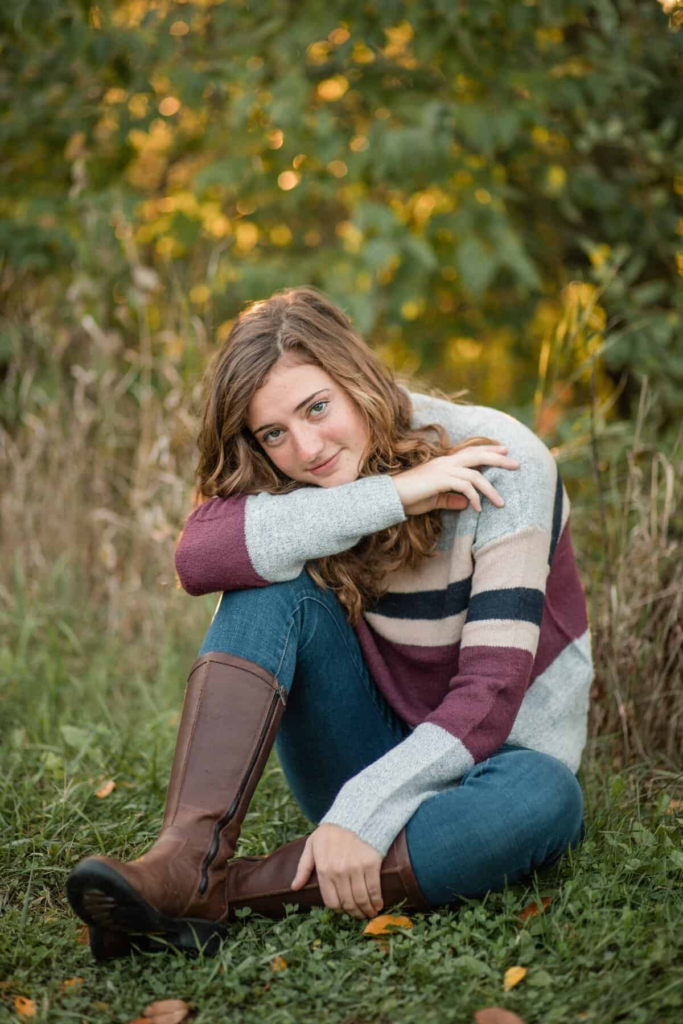 17. Cozy Striped Sweater And Riding Boots