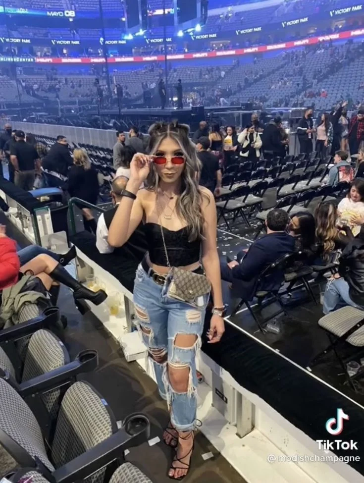 Black Top with Distressed Jeans and Strappy Heel Sandals