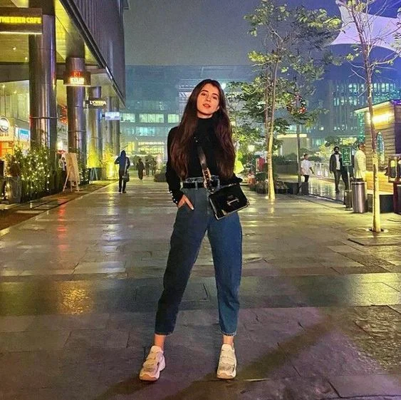 Black Top with Ankle Jeans and Shoes: A Timeless Look