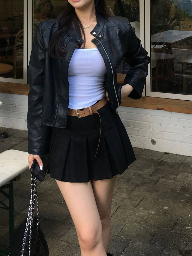. Leather Jacket Meets Pleated Skirt Perfection
