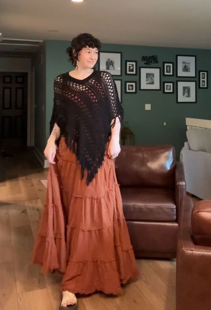 Black Crochet Poncho Over Rust Maxi Skirt